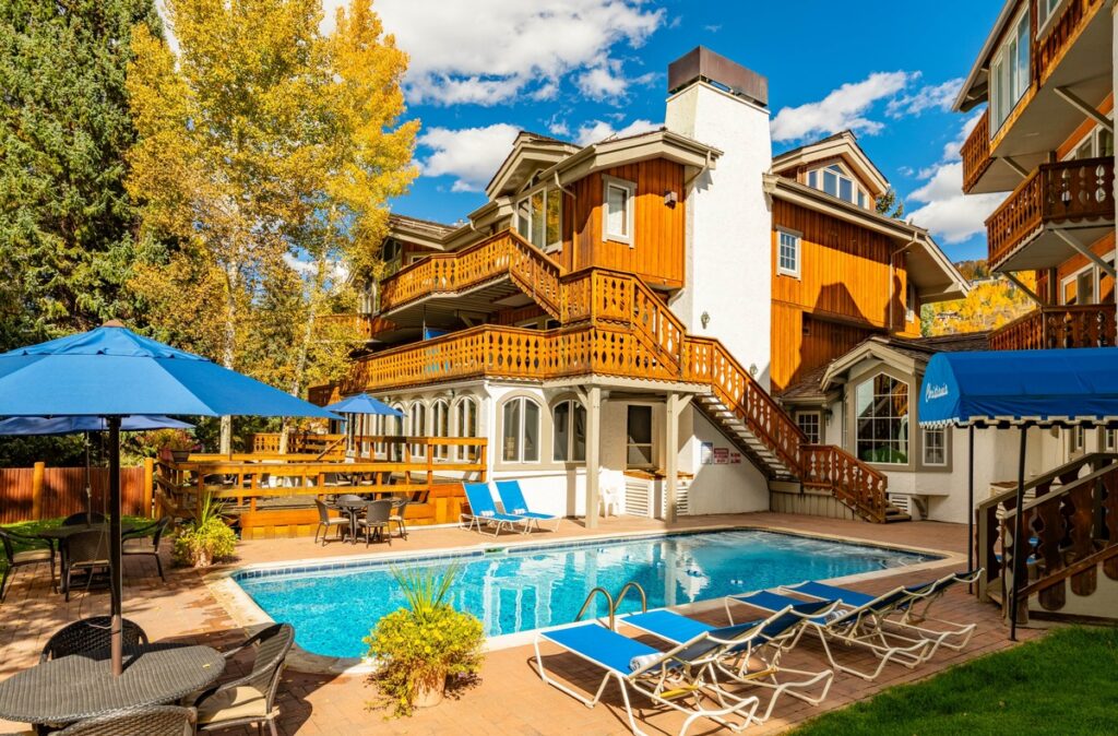 Exterior of Christiania at Vail building and outdoor pool during fall